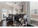 Sitting room featuring dark hardwood floors, accent chairs, and natural light at 919 Pennington Dr, Indian Land, SC 29720