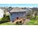 Backyard view of patio with dining set and grill, leading to the fenced yard at 10436 Cullen Ct, Charlotte, NC 28278