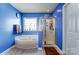 Bright blue bathroom features a bathtub with jets, a shower, and tile floors at 10436 Cullen Ct, Charlotte, NC 28278