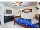 Bedroom with neutral colored walls, ceiling fan, carpet and a queen bed at 10436 Cullen Ct, Charlotte, NC 28278
