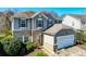 Charming two-story home featuring brick accents, gray siding and an attached two-car garage at 10436 Cullen Ct, Charlotte, NC 28278