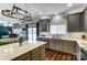Well-lit kitchen with a center island, lots of cabinets and stainless steel appliances at 10436 Cullen Ct, Charlotte, NC 28278