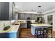 Modern kitchen featuring gray cabinets, marble countertops and stainless steel appliances at 10436 Cullen Ct, Charlotte, NC 28278