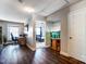 Open-concept living area featuring wood floors, a desk space, and an aquarium at 10436 Cullen Ct, Charlotte, NC 28278