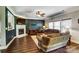 Cozy living room with a fireplace, hardwood floors and plenty of natural light at 10436 Cullen Ct, Charlotte, NC 28278