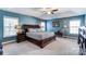 Spacious main bedroom with neutral carpet, tray ceiling and views of the yard at 10436 Cullen Ct, Charlotte, NC 28278