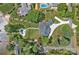 Beautiful aerial view of a luxury home with a pool and lush landscaping in an established neighborhood at 106 Beachview Dr, Mooresville, NC 28117