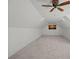 Spacious attic room with a ceiling fan, carpet, and a window with natural light at 106 Beachview Dr, Mooresville, NC 28117
