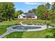 Expansive backyard with a pool, patio furniture, and a well-maintained lawn at 106 Beachview Dr, Mooresville, NC 28117