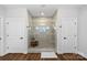 Modern tiled shower enclosed in glass, flanked by two white doors at 106 Beachview Dr, Mooresville, NC 28117