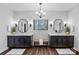 Spacious bathroom with double vanities, modern mirrors and fixtures, and great natural light at 106 Beachview Dr, Mooresville, NC 28117