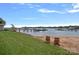Picturesque waterfront view with sandy beach and chair seating at 106 Beachview Dr, Mooresville, NC 28117