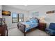 Comfortable bedroom with a sleigh bed, two nightstands, and large windows with beautiful views at 106 Beachview Dr, Mooresville, NC 28117