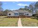 Charming home with brick foundation and a inviting front porch at 106 Beachview Dr, Mooresville, NC 28117