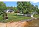 Beautiful waterfront home with expansive lawn, in-ground pool, lake access, and private beach at 106 Beachview Dr, Mooresville, NC 28117