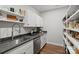 Modern kitchen featuring stainless steel appliances, wooden floors and neutral cabinets at 106 Beachview Dr, Mooresville, NC 28117