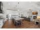 Bright, open-concept kitchen features an island, stainless steel appliances, and seamless flow to the living area at 106 Beachview Dr, Mooresville, NC 28117