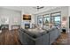 Cozy living room with a fireplace and large windows overlooking the water at 106 Beachview Dr, Mooresville, NC 28117