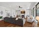 Spacious living room featuring hardwood floors and a charming fireplace at 106 Beachview Dr, Mooresville, NC 28117