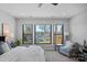 Bright main bedroom with lake views and cozy seating area for relaxing at 106 Beachview Dr, Mooresville, NC 28117