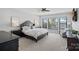 Relaxing main bedroom featuring great natural light and views of the lake at 106 Beachview Dr, Mooresville, NC 28117