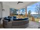 Inviting outdoor patio featuring a comfortable curved seating area overlooking beautiful scenery at 106 Beachview Dr, Mooresville, NC 28117