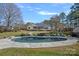 Relaxing outdoor living: pool, lounge chairs, and lush greenery enhance this backyard's appeal at 106 Beachview Dr, Mooresville, NC 28117