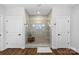 Modern tiled shower with glass door and two entry doors for added convenience at 106 Beachview Dr, Mooresville, NC 28117