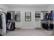 Spacious walk-in closet with customizable shelving, hanging rods, and natural light at 106 Beachview Dr, Mooresville, NC 28117