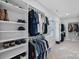 Organized walk-in closet with shelves, drawers, and rods for ample storage space at 106 Beachview Dr, Mooresville, NC 28117