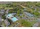Aerial view of community pool and tennis courts surrounded by homes and trees at 10823 Caverly Ct, Huntersville, NC 28078