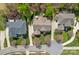 Aerial view of a neighborhood featuring homes, driveways, and mature trees on a sunny day at 10823 Caverly Ct, Huntersville, NC 28078