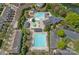 Aerial view of community pool area with swimming pools, lounge chairs, and green space at 10823 Caverly Ct, Huntersville, NC 28078