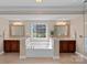 Spacious bathroom featuring dual vanities, a garden tub, and neutral color palette at 10823 Caverly Ct, Huntersville, NC 28078