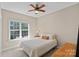 Bright bedroom with large window, ceiling fan and natural light enhances the space at 10823 Caverly Ct, Huntersville, NC 28078