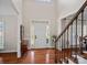 Bright, two-story foyer with hardwood floors, a staircase, and a front door with sidelights at 10823 Caverly Ct, Huntersville, NC 28078