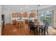 Well-designed kitchen featuring wooden cabinetry, a kitchen island, and an adjacent dining area at 10823 Caverly Ct, Huntersville, NC 28078
