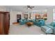 Open-concept living room with modern furnishings, hardwood floors, and seamless flow to the kitchen at 10823 Caverly Ct, Huntersville, NC 28078