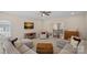 Bright living room with hardwood floors, neutral tones, and natural light at 10823 Caverly Ct, Huntersville, NC 28078