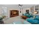 Spacious living room featuring a large entertainment center, comfortable seating, and ample natural light at 10823 Caverly Ct, Huntersville, NC 28078