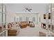 Spacious living room with carpet, ceiling fan, neutral tones, and natural light at 10823 Caverly Ct, Huntersville, NC 28078