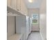 Charming pantry with ample cabinet space and tile floors, adjacent to window offering natural light at 10823 Caverly Ct, Huntersville, NC 28078