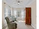 Sitting room with comfortable armchairs, a ceiling fan, and large windows at 10823 Caverly Ct, Huntersville, NC 28078
