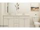 Bathroom featuring a double vanity with white cabinets and modern fixtures at 109 Dogwood Grove Pl, Troutman, NC 28166