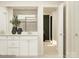 Bathroom showcasing a double vanity with white cabinets and modern fixtures at 109 Dogwood Grove Pl, Troutman, NC 28166