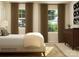 Well-lit bedroom with two windows, neutral walls, curtains, and modern furniture at 109 Dogwood Grove Pl, Troutman, NC 28166