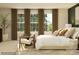 Well-lit bedroom with a large window and cozy seating area at 109 Dogwood Grove Pl, Troutman, NC 28166