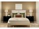 Comfortable bedroom featuring a plush bed with decorative pillows and matching nightstands at 109 Dogwood Grove Pl, Troutman, NC 28166