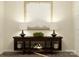 Elegant entryway featuring a stylish console table, lamps, and decorative artwork at 109 Dogwood Grove Pl, Troutman, NC 28166