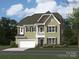 Charming two-story home boasts stone accents, a two-car garage, and a welcoming front porch at 109 Dogwood Grove Pl, Troutman, NC 28166
